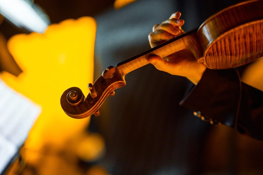 A back shot of a violin at a Candlelight concert