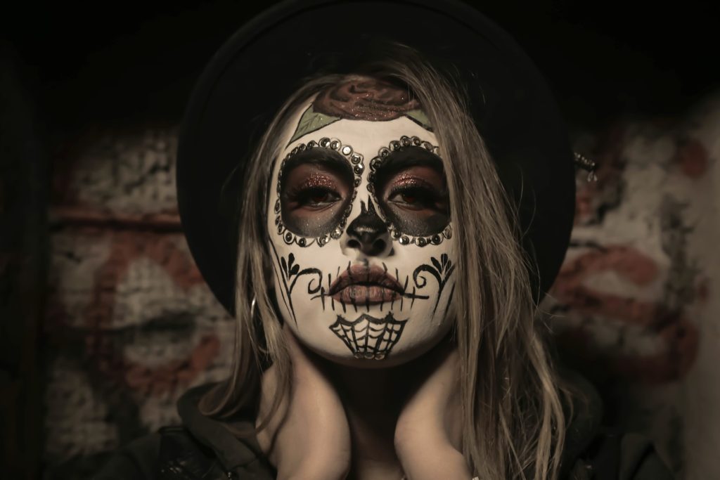 woman painted with day of the dead face paint