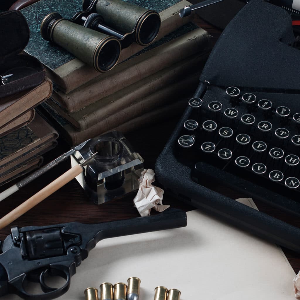 Typewriter and a gun on a table