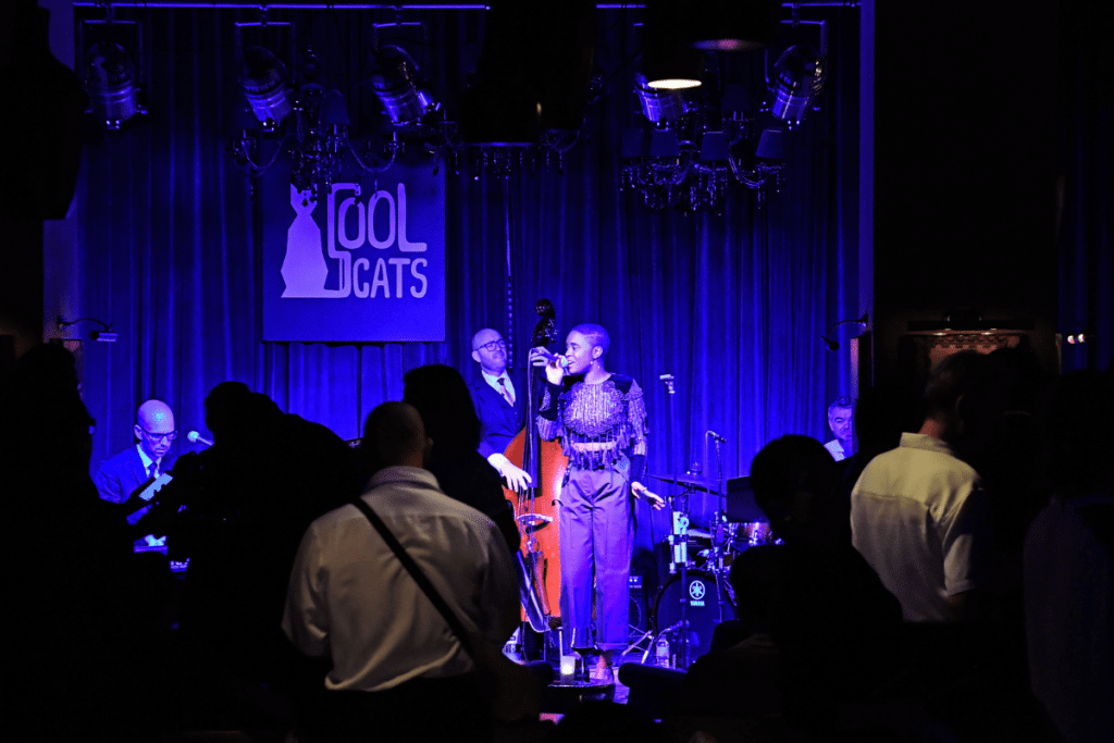 Woman performing on stage at Cool Cats Lounge